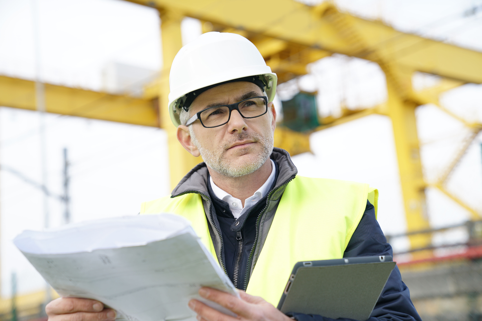 ParagonQMS auditor in hi-vis and hard hat carrying out a client site safety review